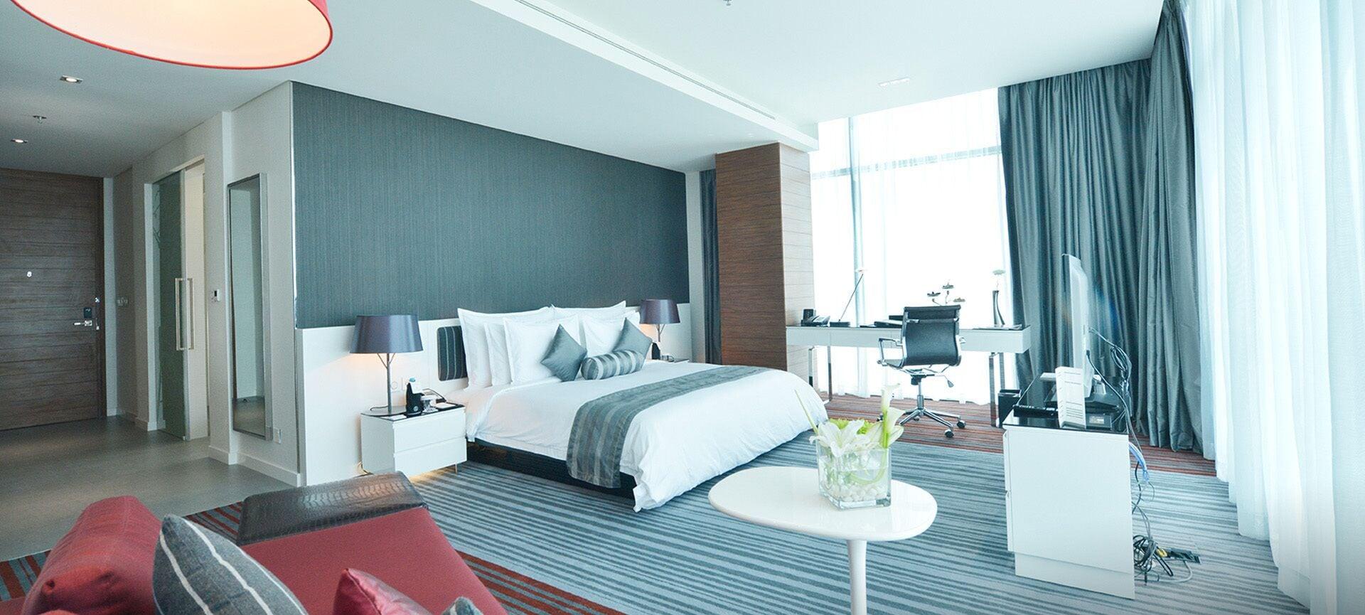 Ramee Grand Hotel And Spa Manama Exteriör bild A bedroom in a hotel